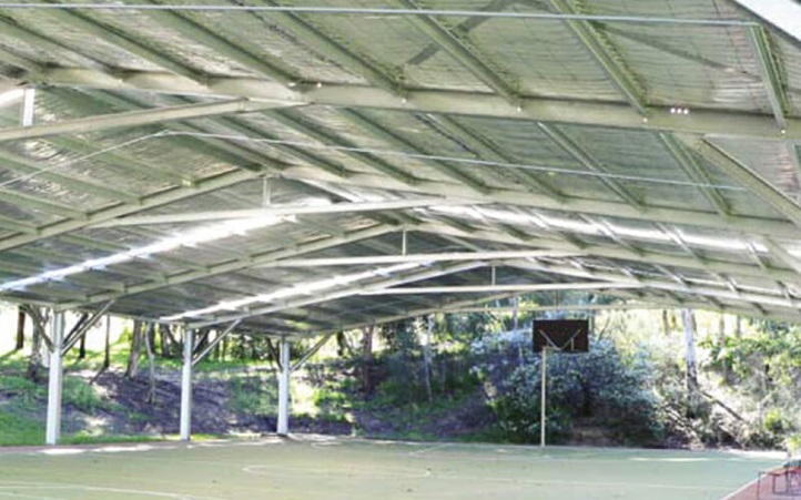 A custom-designed multi-bay steel shed with skillion roof on a modern Australian property